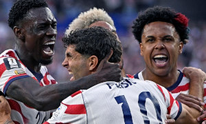 USMNT soccer stars celebrate a goal at the World Cup